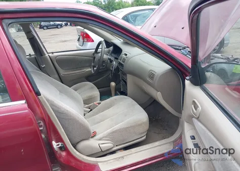 1999 Toyota Corolla Ce from USA, damaged, VIN 2T1BR12E4XC228371